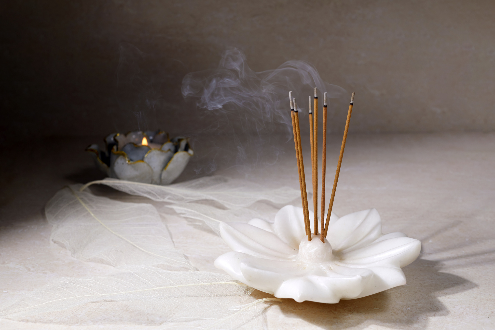 Incense Sticks on a Flower-shaped Incense Holder 